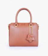Brown handbag with flower charm