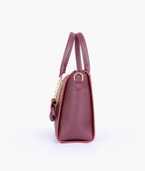 Burgundy handbag with flower charm