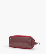 Burgundy suede handbag with braided handle