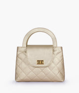 Golden flap quilted bag with top handle