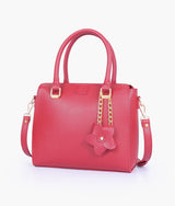 Red handbag with flower charm