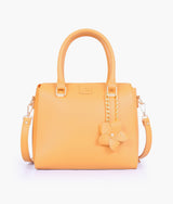 Mustard handbag with flower charm