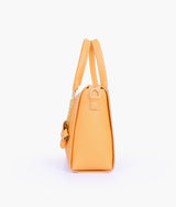 Mustard handbag with flower charm